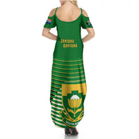 Green maxi dress with racerback straps, Banyana Banyana text, and crest hem