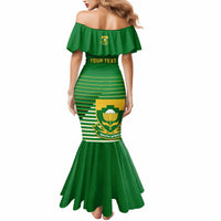 Green off-shoulder mermaid dress with striped front panel and crest, ruffle sleeves