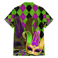 Green Hawaiian shirt with jester mask art, purple argyle pattern, and colorful bead trim