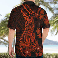 Mens black Hawaiian shirt worn from back, orange-red shark tattoo and red floral pattern