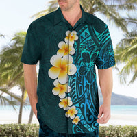 Turquoise Hawaiian shirt with plumeria flower and tribal tiki-style panel on chest