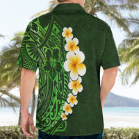 Green Hawaiian shirt for men, back view, with plumeria flower graphic and leaf print