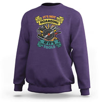Purple sweatshirt with multicolor woodworker tools graphic on the chest