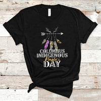 Black T-shirt with colorful feather arrow graphic and “Columbus Indigenous People’s Day” text