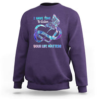 Purple sweatshirt with colorful butterfly graphic and “I have time to listen / Your life matters”.