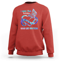 Red sweatshirt with colorful butterfly graphic and “I have time to listen / Your life matters”.