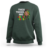 Dark forest green crewneck sweatshirt with 'THICK THIGHS AND LOC'D VIBES' front graphic