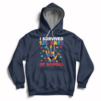 Navy pullover hoodie with colorful puzzle heart graphic and “I Survived 120 Days of School” text