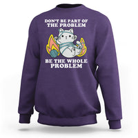 Purple crewneck sweatshirt with cat graphic and 'BE THE WHOLE PROBLEM' text