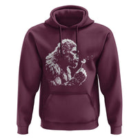Bigfoot Blowing Dandelion Flower Graphic Hoodie Whimsical Sasquatch Profile Artistic Vintage Distressed