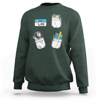 Dark forest green crewneck sweatshirt with lab tech graphic on front