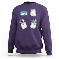 Purple crewneck sweatshirt with lab tech graphic on front