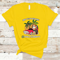 Men's yellow graphic T-shirt, 'Mid Year Report' 'Still Naughty' Santa beach print