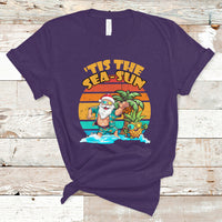 Purple crewneck graphic T-shirt with Santa in tropical beach scene print