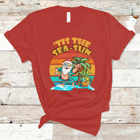 Red crewneck graphic T-shirt with Santa in tropical beach scene print