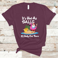 Maroon novelty Christmas in July T-shirt with cartoon Santa, palm trees, and text graphic