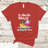 Red novelty Christmas in July T-shirt with cartoon Santa, palm trees, and text graphic
