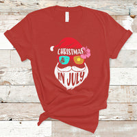 Red short-sleeve T-shirt with Christmas in July Santa face graphic