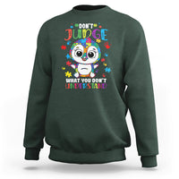 Autism awareness penguin sweatshirt, forest green with colorful penguin graphic and text