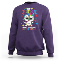 Autism awareness penguin sweatshirt, purple with colorful penguin graphic and text