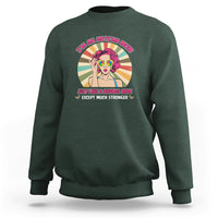 Forest green sweatshirt with front “I’m an Autism Mom” graphic and colorful character.