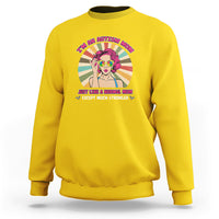 Daisy yellow sweatshirt with front “I’m an Autism Mom” graphic and colorful character.