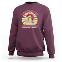 Maroon sweatshirt with front “I’m an Autism Mom” graphic and colorful character.