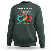 Dark forest green autism awareness sweatshirt with colorful puzzle feather graphic and crew neck