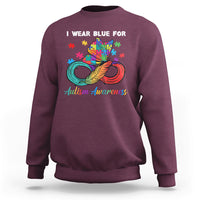Maroon autism awareness sweatshirt with colorful puzzle feather graphic and crew neck