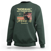 Dark forest green crewneck sweatshirt with front religious quote graphic: "Jesus is"