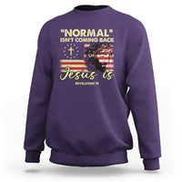 Purple crewneck sweatshirt with front religious quote graphic: "Jesus is"
