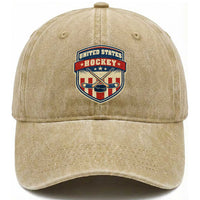 Hockey Crossed Sticks And Puck Retro USA Shield Flag Washed Cotton Baseball Cap Red White Blue Striped Patriotic Sports Fan Pride Graphic