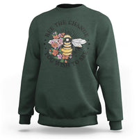 Dark green women's graphic sweatshirt with bee-and-flower slogan print