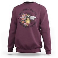 Maroon women's graphic sweatshirt with bee-and-flower slogan print