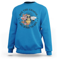 Blue women's graphic sweatshirt with bee-and-flower slogan print