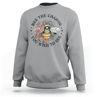 Gray women's graphic sweatshirt with bee-and-flower slogan print