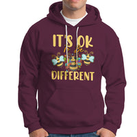 Maroon autism awareness hoodie with front pocket, drawstring hood, and bee graphic text