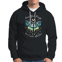 Black women's hoodie with hood and front pocket; turquoise moth crescent moon graphic.