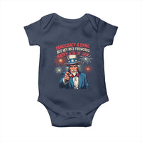 Funny 4th of July Democracy Is Dying Baby Onesie But Hey Nice Fireworks Satirical Uncle Sam - Wonder Print Shop
