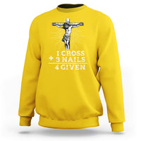 Daisy yellow crewneck sweatshirt with white crucifix graphic and text “1 CROSS 3 NAILS 4 GIVEN”.