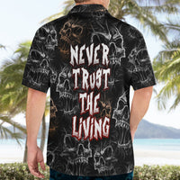Black Hawaiian shirt back with large skull print and "Never Trust The Living" text.