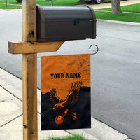 Flying Eagle Carrying Bowling Ball Garden Flag with Grunge Orange and Black Splatter Design - Wonder Print Shop