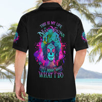 Black short-sleeve button-up shirt, back graphic with skull, flowers, and quote