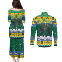 Gabon Christmas Couples Matching Puletasi and Long Sleeve Button Shirt with Black Panthers Carrying Tree and Green Yellow Snowflake Pattern - Wonder Print Shop