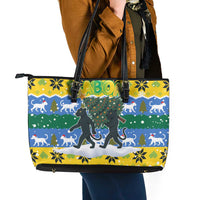 Gabon Christmas Leather Tote Bag with Black Panthers Carrying Tree and Green Yellow Snowflake Pattern - Wonder Print Shop