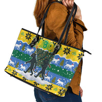 Gabon Christmas Leather Tote Bag with Black Panthers Carrying Tree and Green Yellow Snowflake Pattern - Wonder Print Shop