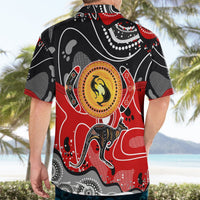 Hawaiian shirt back with red-and-black kangaroo dot art and yellow circular center emblem