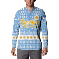 Argentina Christmas Button Sweatshirt with Blue-White Snowflake Pattern, Sun Emblem, and Gaucho Santa Riding Horse Motif - Wonder Print Shop