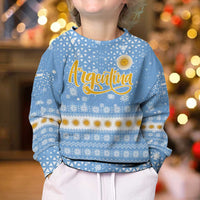 Argentina Christmas Kid Ugly Christmas Sweater with Blue-White Snowflake Pattern, Sun Emblem, and Gaucho Santa Riding Horse Motif - Wonder Print Shop