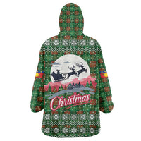 Guadeloupe Christmas Wearable Blanket Hoodie with Green-Red Plaid Design, Sun and Sugarcane Emblem, and Santa Sleigh Motif - Wonder Print Shop